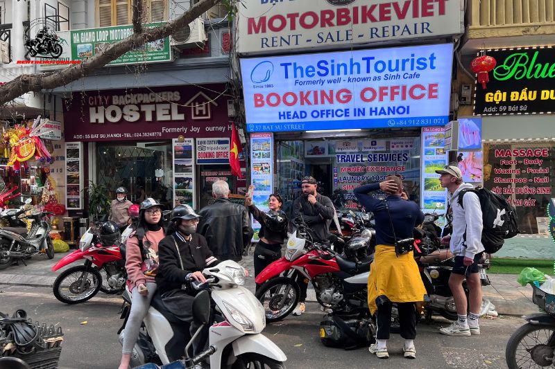 Motorbike riders preparing in front of travel agency in Hanoi Old Quarter