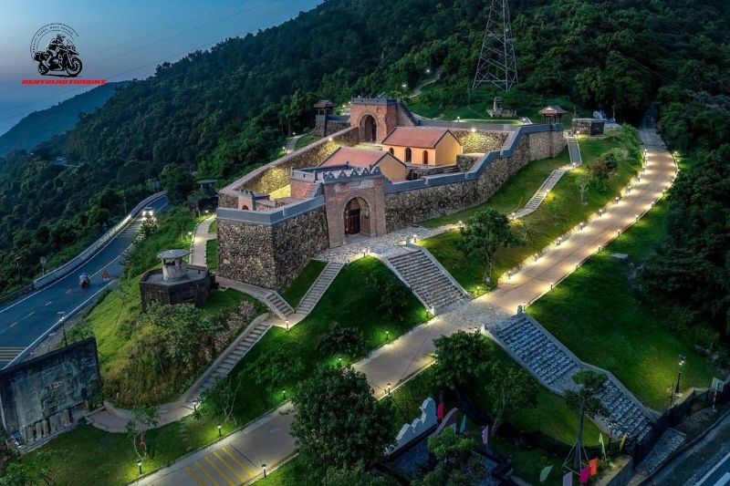 Hai Van Gate lit up at night on a mountain pass
