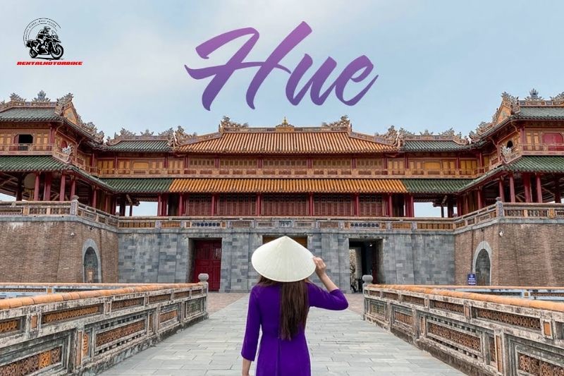 Woman in áo dài at Hue Imperial City gate