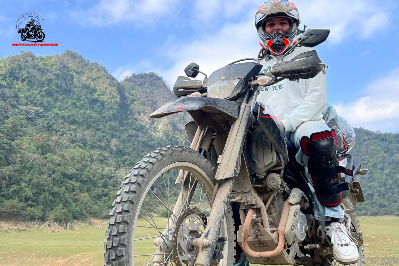 Rider on dirt bike exploring Vietnam mountain trail